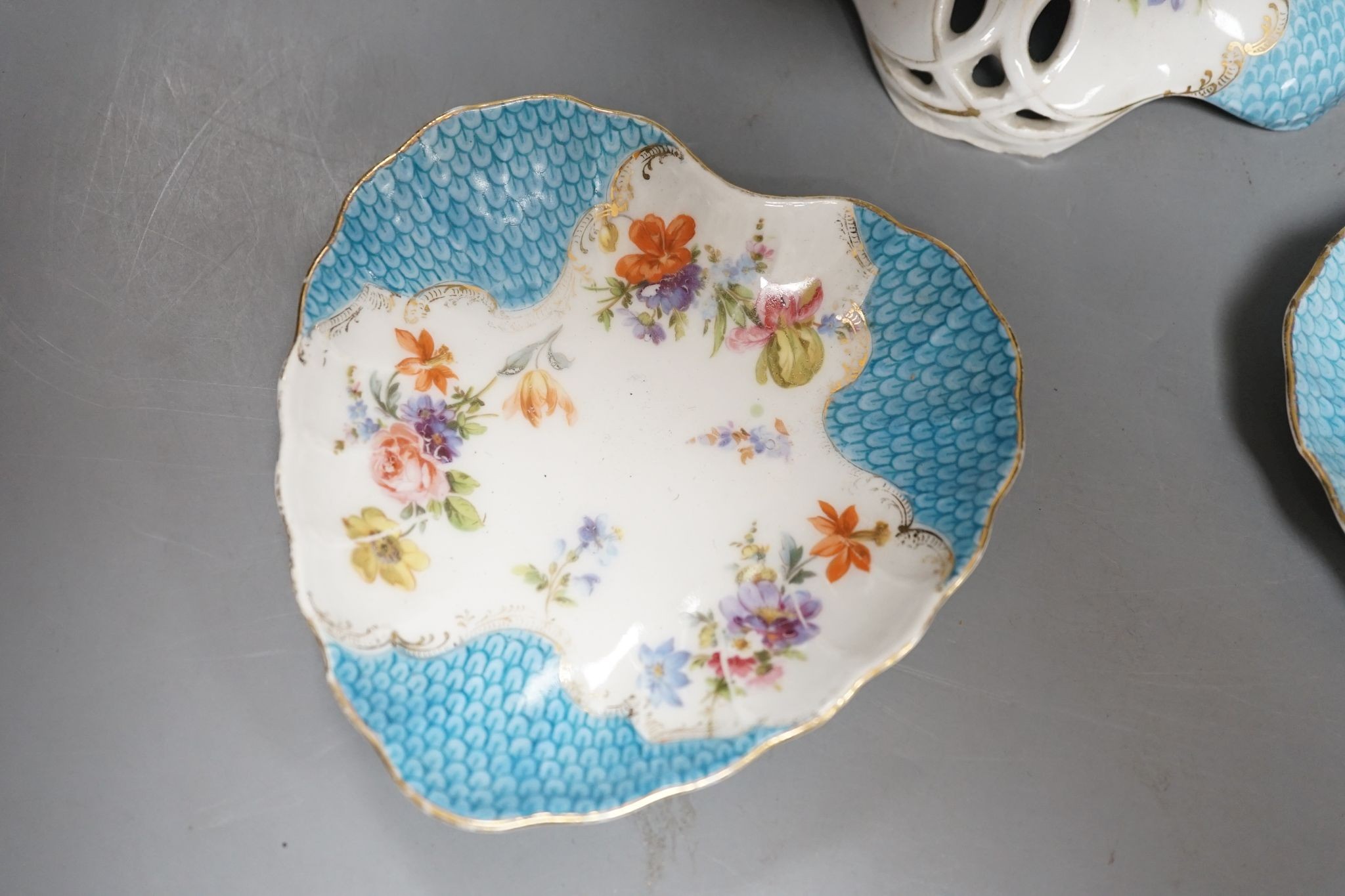 A floral and gilt dessert set, comprising of: 3 comports, 10 plates and 6 assorted dishes.